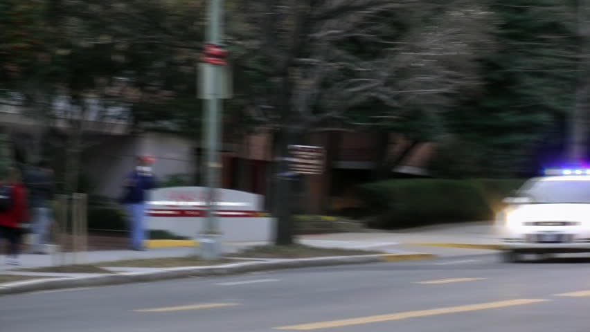 WASHINGTON, DC, MAR. 2012.  DC Police car speeds past, siren blazing. The police dept. is unique because it carries out activities normally done by county & state police in addition to usual functions