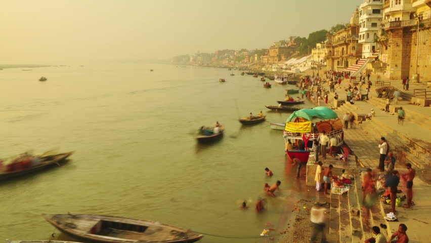 INDIA - NOVEMBER 21: Indian pilgrims rowing boat in sunrise, Ganges river on November 21, 2010 in Varanasi, India.