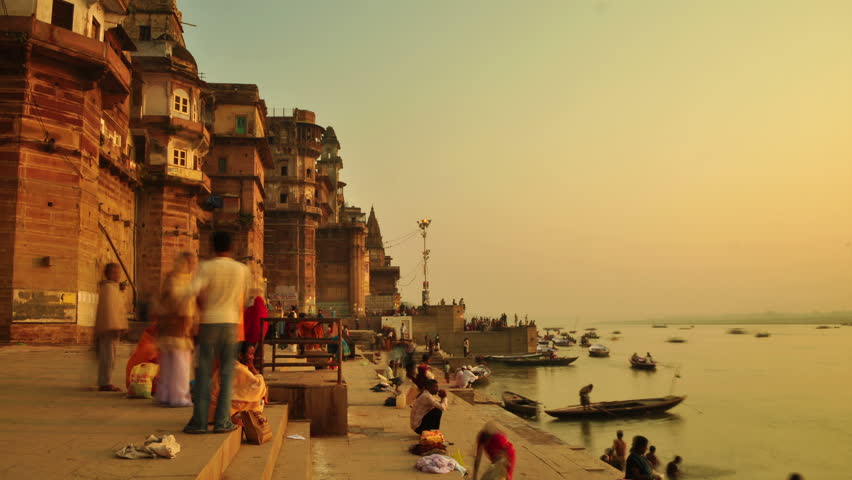 INDIA - NOVEMBER 21: Indian pilgrims rowing boat in sunrise, Ganges river on November 21, 2010 in Varanasi, India.