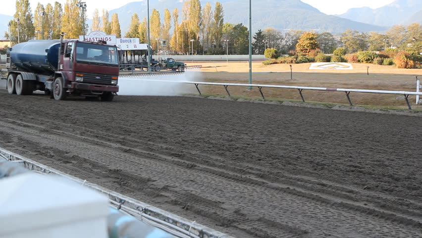 VANCOUVER, BC â OCTOBER 8th: Water truck prepares the track at Hastings Racecourse on Oct 8th, 2012 in Vancouver, BC, Canada.  Hastings Racecourse is four miles from downtown Vancouver, BC, Canada.