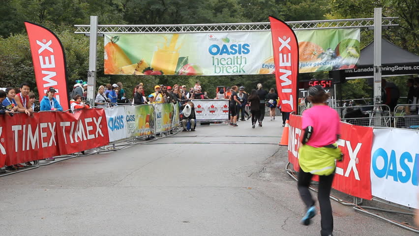 TORONTO, CANADA - SEPTEMBER 21st: Participants finishing the Oasis Zoo run on September 21st, 2012. The Oasis Zoo run is a fundraising running event, sponsored by the Oasis brand of fruit juice drinks. 