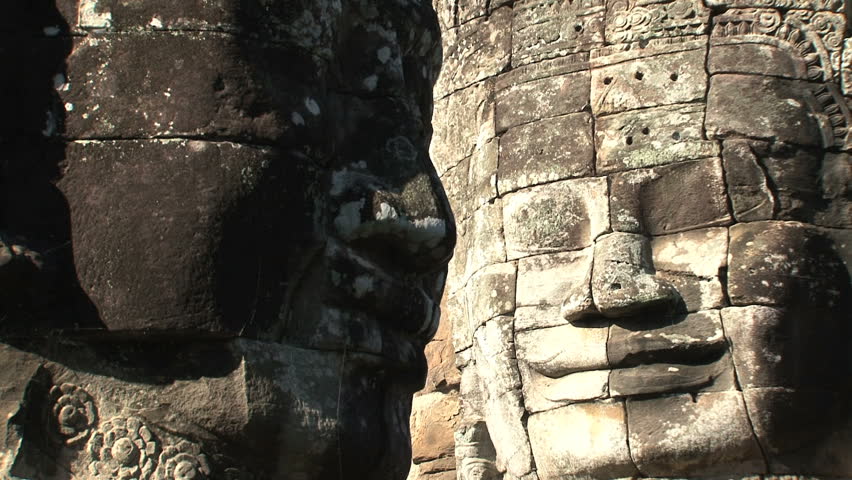 Zoom out from a face at Angkor Wat, Siem Reap, Cambodia