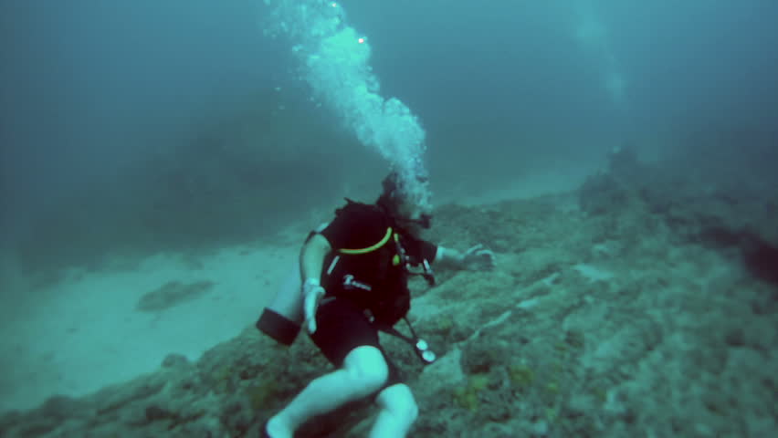 Scuba diver Pacific Ocean Puerto Vallarta, Banderas Bay. Tropical tourism destination for sports, relaxation of warm tropic vacation. Underwater rock and coral reef around Marietas Islands.
