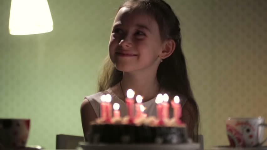 Birthday girl and cake with candles
