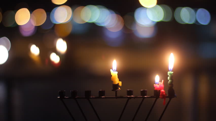 Beautiful candles and hanukkah menorah with defocus background