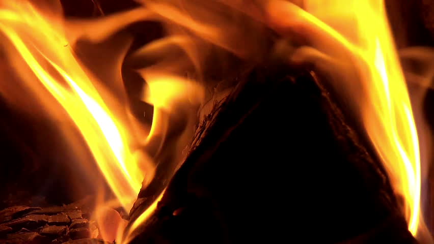 Slow motion fire in furnace with opened doors 
