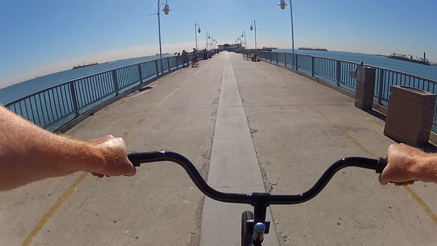 LONG BEACH - NOV 12: The point of view of someone riding a bike on the Veteran's fishing pier on November 12, 2012 in Long Beach, CA. Long Beach has the goal to be the most bicycle friendly U.S. city.