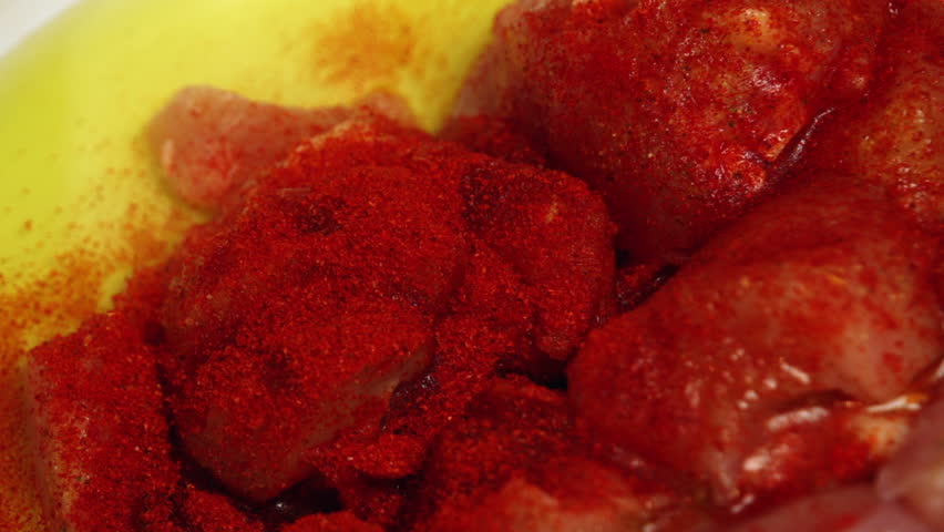 Seasoning chicken meat with spices