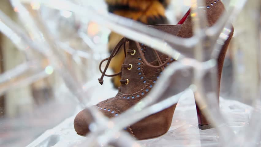 Womans shoes on display in GUM on Jan 20, 2011 in Moscow, Russia. GUM building hosting more than thousand stores. Tracking shot.
