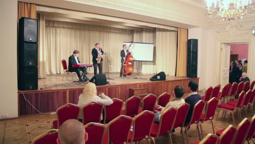 MOSCOW - DECEMBER 12: Musicians trio play music on stage during PolitProsvet award on December 12, 2011 in Moscow, Russia. Journalistic award for political education had been presented at first time
