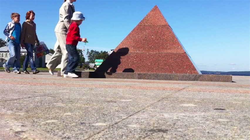 PETROZAVODSK, RUSSIA -JULY 25: Time lapse of kids playing on pyramid monument on July 25, 2011, Petrozavodsk, Russia. Pyramid monument built to commemorate new city quay construction
