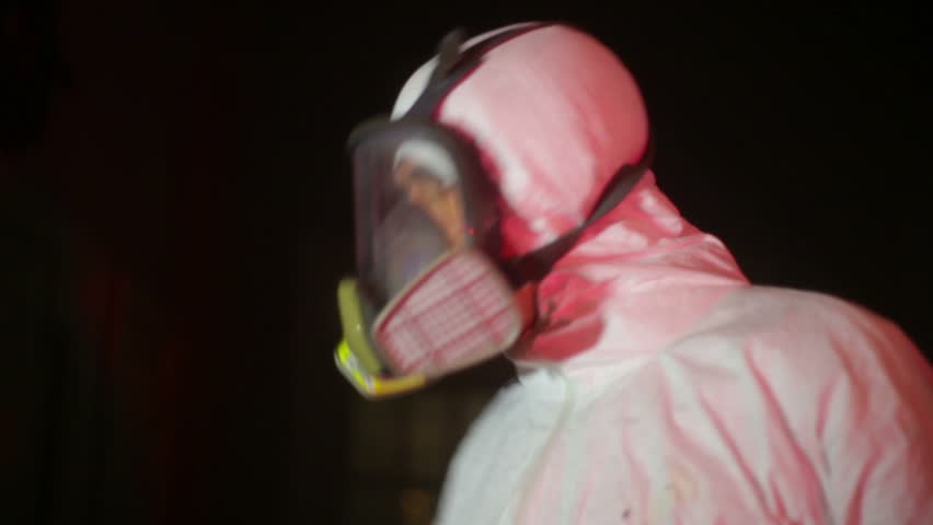 hazmat scientist with a test tube