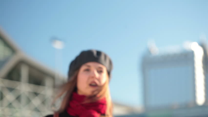 Close-up of a girl calling a taxi.
