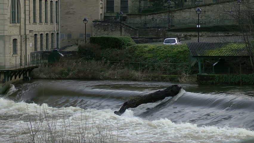 River Torrent
A torrential River rushes over a ridge next to an old Yorkshire Mill