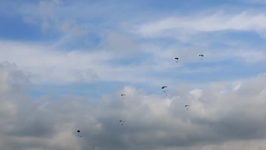 Skydivers jump on a blue sky