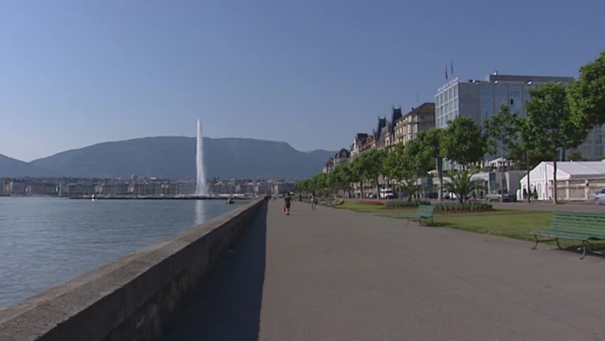 GENEVA, SWITZERLAND: boulevard lake Geneva + pan city.  Geneva's water-jet is one of the largest fountains in the world