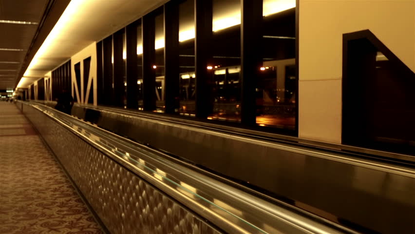 PHOENIX, ARIZONA - CIRCA NOV 2012: Time lapse of airport passenger walkway Phoenix at night circa November 2012. Business and vacation travel increases as economy improves.
