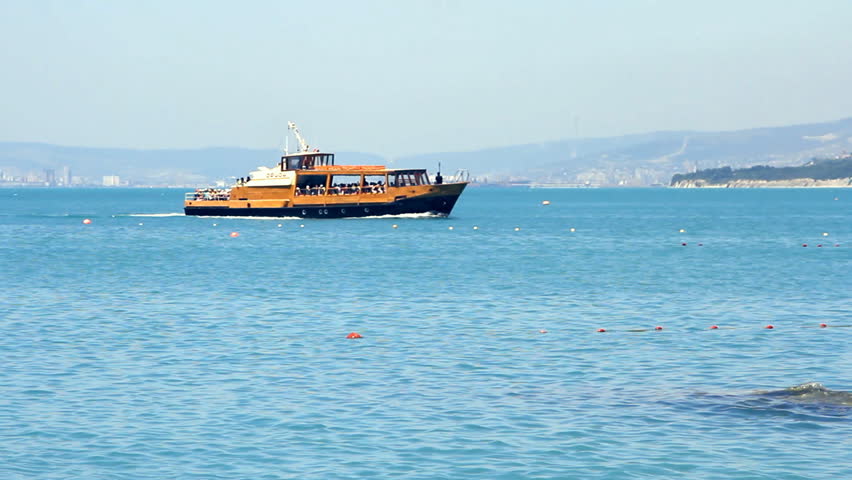 Pleasure boat floats on the sea