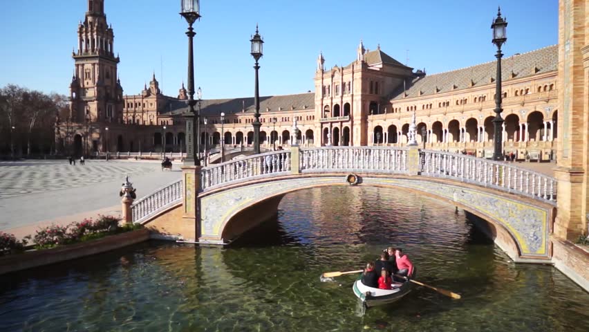 SEVILLE, SPAIN - JANUARY 6: Tourists enjoy a trip on boat on Plaza de Espana Seville on Jan 6, 2013 It was built in 1928 for the Ibero-American Exposition of 1929 designed by architect Anibal Gonzalez