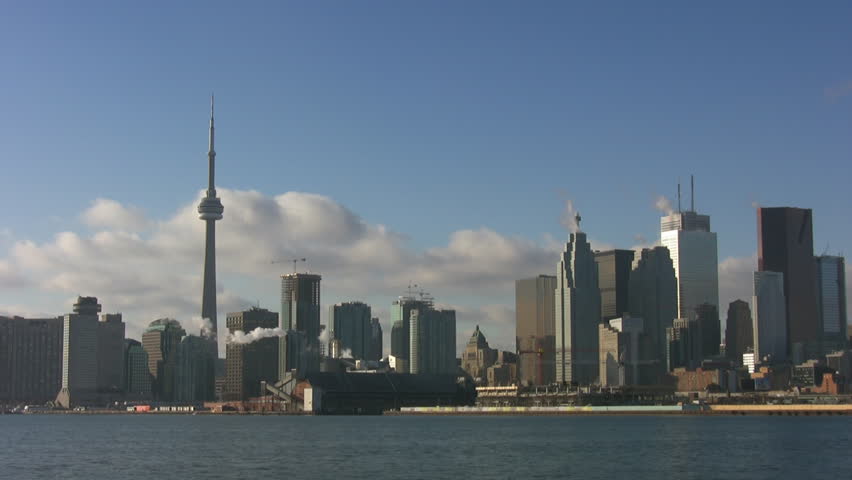 Timelapse shot of Toronto skyline on clear, winter morning. 