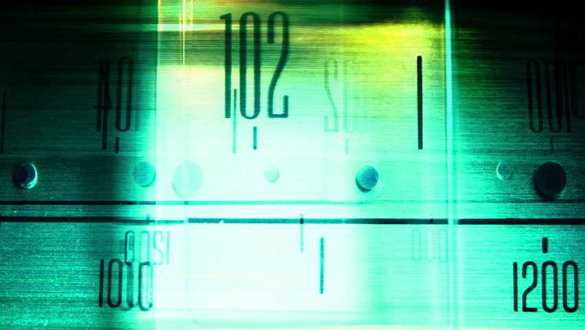 a glowing radio with the marker running through the different stations and frequencies