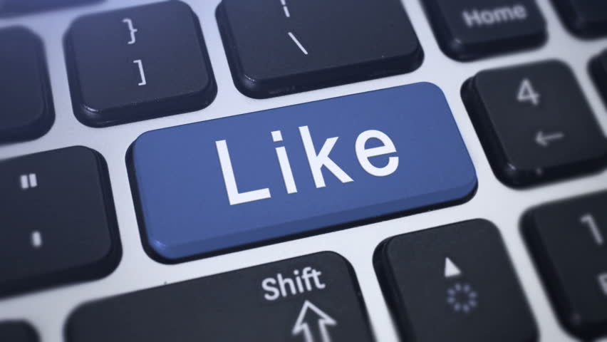 Like Button. Tracking shot of the computer keyboard key Like. 