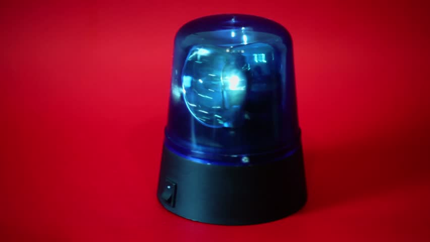 Blue flasher passes with circling light on red background