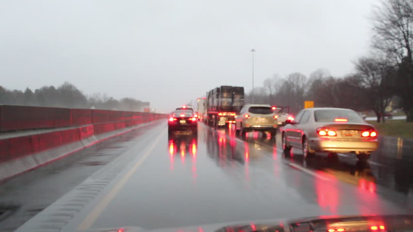Dangerous rainy driving along an interstate caused by winter storm