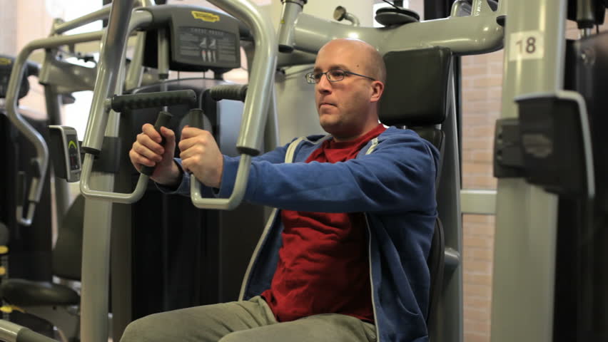 bald overweight man training biceps