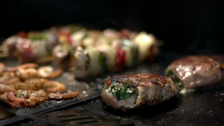 Cooking chicken skewers on a BBQ