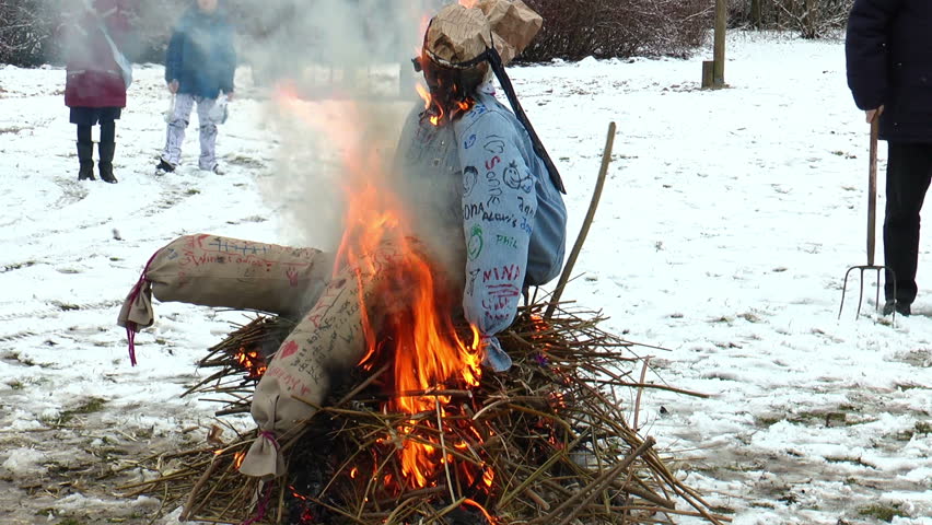 GESCHER, GERMANY-FEBRUARY 8: Burning a straw doll on a funeral pyre for driving out the winter on February 8, 2013 in Gescher, Germany.
