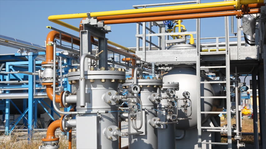 Underground storage of natural gas. Factory distribution, and industrial processing of natural gas with Worker. Many pipelines and construction. 
