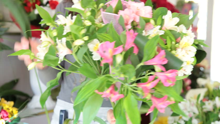 Young Female Florist Creating Flower Arrangement Of Alstroemeria In Her Store. Focus On The Bouquet 