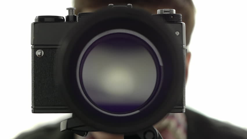 photographer operating an analog camera taking pictures beautiful iris operation