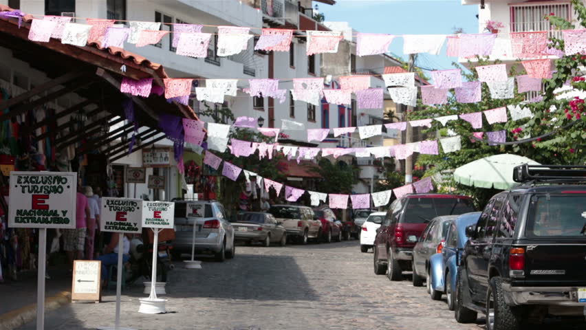 PUERTO VALLARTA, MEXICO NOV 2012: Mexican economy and tourism improves bringing increased traffic to business section of town. Tourist shopping old town Puerto Vallarta shopping area reserved tourist.