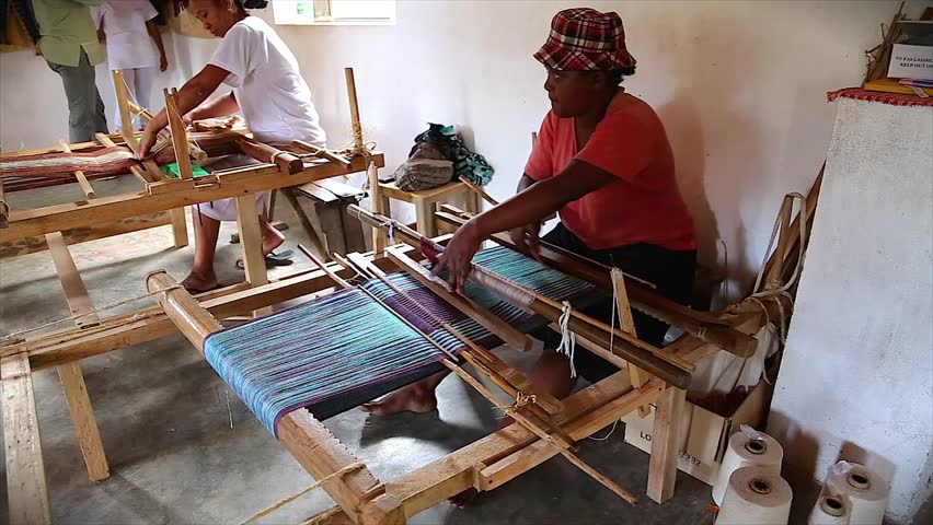 RANOMAFANA, MADAGASCAR - January 3: Local women exhibit new skill after training to weave in order to earn an income to survive and feed their families on January 3, 2013 in Ranomafana, Madagascar.