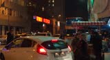 ISTANBUL, TURKEY â FEBRUARY 6: Turkish people walking at rush hour, with cars on the street and shops in the background on February 6, 2013 in Istanbul, Turkey.