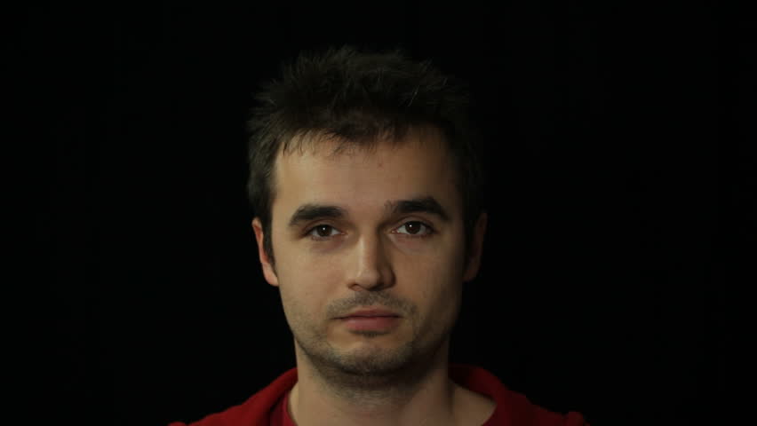 Positive man nodding his head and laughing, studio isolated.