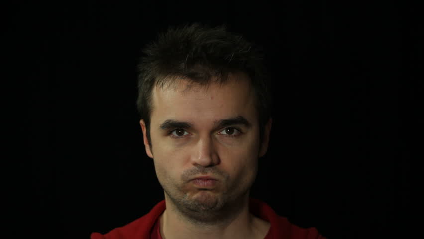 Man making funny faces, studio isolated
