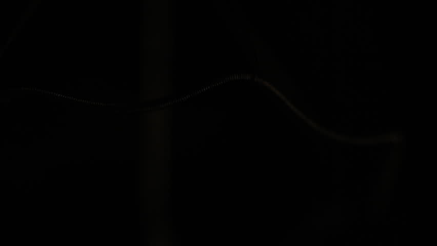 Real light bulb flickering. Macro.