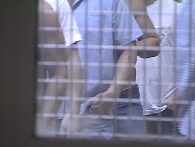Prisoners through a reenforced door. 