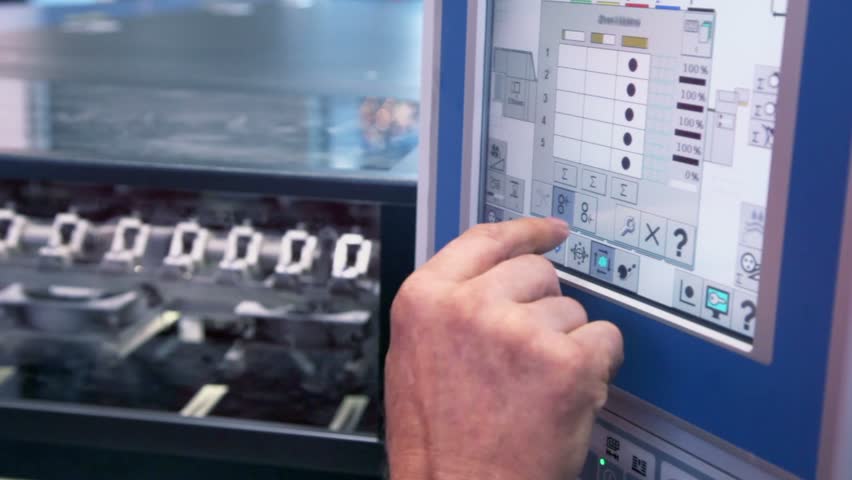 MOSCOW - OCT 8: Finger pushes buttons on control unit of printing conveyor during 23rd exhibition Polygraphinter at Crocus Expo, Oct 8, 2011, Moscow, Russia. Total exhibition area reached 25000 sq. m.