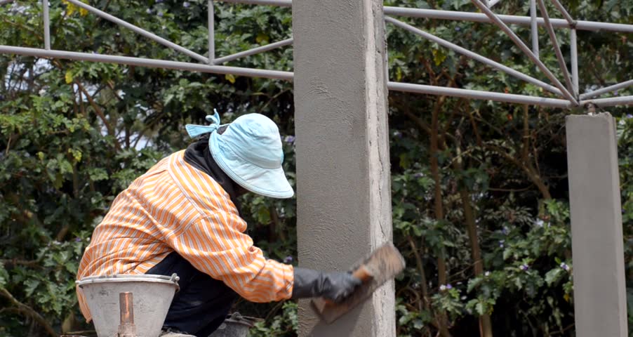 Woman Plastering  