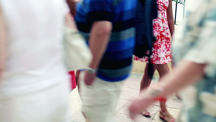 Three female friends after shopping walking on the street, steadycam shot


