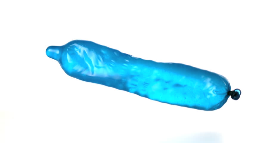 Blue condom filled with water falling and bouncing in slow motion on white background