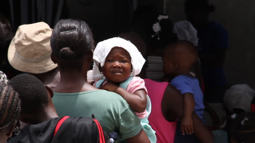 HAITI - CIRCA MAY 2012: lines of people at vaccination clinic in Haiti in Port-Au-Prince 