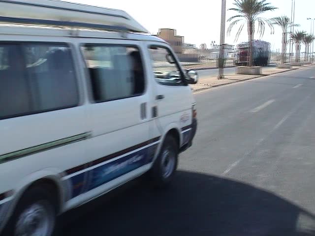 Van driving off into the sunset, Red Sea, Egypt