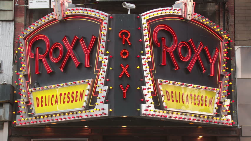 NEW YORK - MARCH 10: The lighted marquee sign for the Roxy Delicatessen flashes in Times Square on March 10, 2013 in New York City.