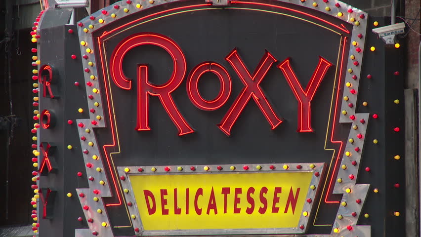 NEW YORK - MARCH 10: The lighted marquee sign for the Roxy Delicatessen flashes in Times Square on March 10, 2013 in New York City.