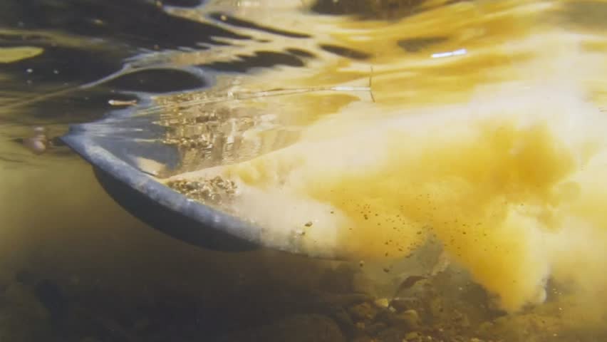 underwater view of panning for gold